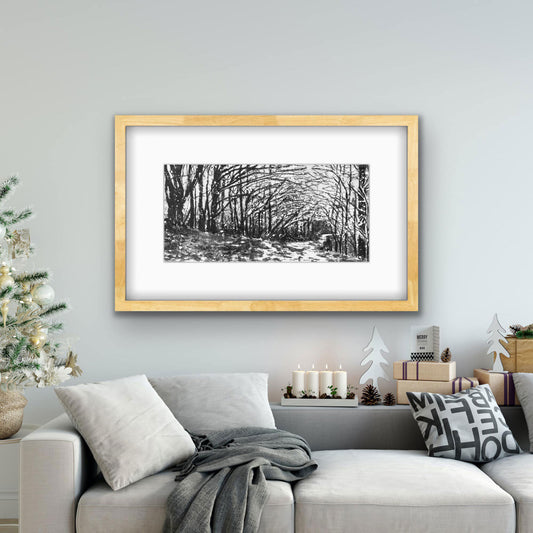 Cold November black and white forest print displayed in modern room setting by Canadian watercolour artist Brigitte Klassen.